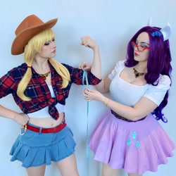Size: 1080x1080 | Tagged: safe, applejack, rarity, human, clothes, cosplay, costume, cowboy hat, cutie mark on clothes, duo, duo female, eyeshadow, female, glasses, hat, irl, irl human, kumoricon, makeup, measuring tape, photo
