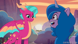 Size: 600x338 | Tagged: safe, screencap, blaize skysong, izzy moonbow, dragon, unicorn, g5, my little pony: tell your tale, the blockywockys, spoiler:g5, spoiler:my little pony: tell your tale, spoiler:tyts02e00, animated, dragoness, female, gifrun.com, horn, mare, the isle of scaly (location)