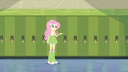 Size: 1280x720 | Tagged: safe, screencap, fluttershy, equestria girls, g4, my little pony equestria girls, backpack, boots, canterlot high, clothes, cutie mark on clothes, fluttershy's skirt, lockers, pointing, polka dot socks, shoes, skirt, socks, solo