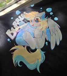 Size: 2653x3019 | Tagged: safe, artist:mirtash, derpy hooves, pegasus, pony, g4, blonde mane, blonde tail, bubble, chest fluff, countershading, cute, derp, derpabetes, design, ear fluff, eyelashes, female, gray coat, high res, in air, irl, long mane, long tail, mare, open mouth, open smile, partially open wings, photo, raised hoof, shiny eyes, shirt design, smiling, solo, tail, teeth, text, wing fluff, wingding eyes, wings, yellow eyes