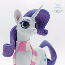 Size: 2560x2560 | Tagged: safe, alternate angle, alternate version, artist:lakterra, rarity, pony, unicorn, g4, close-up, clothes, craft, female, figurine, horn, irl, mare, photo, polymer clay, scarf, signature, simple background, smiling, solo, striped scarf, tail, white background