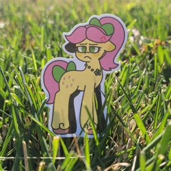 Size: 8192x8192 | Tagged: safe, artist:comicmaker, posey bloom, earth pony, pony, g5, blushing, bow, cross-popping veins, emanata, female, floppy ears, frown, grass, grumpy, hair bow, irl, jewelry, mare, necklace, photo, posey bloom is not amused, solo, sticker, tail, tail bow, unamused, unshorn fetlocks