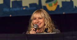Size: 1600x844 | Tagged: safe, human, andrea libman, big apple ponycon, irl, irl human, microphone, no pony, photo, voice actor