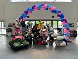 Size: 2048x1536 | Tagged: safe, artist:spainfischer, pinkie pie, oc, oc:aurora sol, oc:lightning flash, griffon, trotcon, g4, 2023, balloon, furry, fursuit, griffon oc, group photo, irl, photo, ponysuit, tank (vehicle)