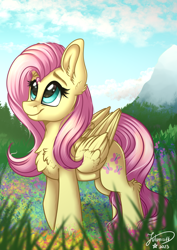 Size: 2894x4093 | Tagged: safe, artist:julunis14, fluttershy, pegasus, pony, g4, chest fluff, cloud, cute, ear fluff, female, flower, folded wings, grass, high res, leg fluff, looking up, mare, mountain, outdoors, redraw, shyabetes, signature, sky, smiling, solo, wings