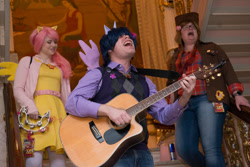 Size: 1024x684 | Tagged: safe, artist:karredroses, artist:the shake ups, applejack, fluttershy, twilight sparkle, human, g4, clothes, cosplay, costume, guitar, irl, irl human, musical instrument, photo, ponycon 2016, ponycon nyc, tambourine