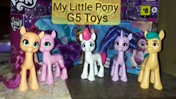 Size: 960x540 | Tagged: safe, hitch trailblazer, izzy moonbow, pipp petals, sunny starscout, zipp storm, earth pony, pegasus, pony, unicorn, g5, brush, brushable, concave belly, dollar general, horn, logo, mane five, merchandise, photo, price tag, skinny pipp, slender, text, thin, toy