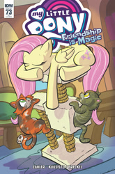 Size: 2063x3131 | Tagged: safe, artist:thom zahler, idw, official comic, fluttershy, cat, pegasus, pony, g4, spoiler:comic, spoiler:comic73, behaving like a cat, cat tree, comic cover, cover, cover art, eyes closed, fluttershy's cottage, folded wings, indoors, lying down, my little pony logo, prone, tail, underhoof, variant cover, wings