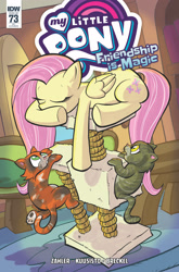 Size: 2063x3131 | Tagged: safe, artist:thom zahler, idw, official comic, fluttershy, cat, pegasus, pony, friendship is magic #73, g4, spoiler:comic, behaving like a cat, cat tree, comic cover, cover, cover art, eyes closed, fluttershy's cottage, folded wings, indoors, lying down, my little pony logo, prone, tail, underhoof, variant cover, wings