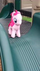 Size: 2618x4656 | Tagged: safe, pinkie pie, earth pony, pony, caption, irl, outdoors, photo, plushie, slide, solo, text