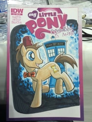 Size: 768x1024 | Tagged: safe, artist:thom zahler, idw, doctor whooves, time turner, pony, g4, spoiler:comic13, 2014, bowtie, comic cover, commission, cover, cover art, doctor who, fez, grin, hat, irl, male, my little pony logo, new york comic con, new york comic con 2014, photo, raised hoof, smiling, solo, stallion, tail, tardis, traditional art