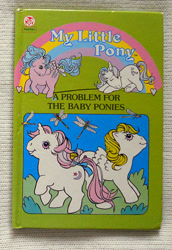 Size: 651x945 | Tagged: safe, baby moondancer, baby surprise, firefly, glory, dragonfly, insect, pegasus, pony, unicorn, g1, official, baby, baby pony, book, book cover, bow, cover, female, filly, foal, horn, mare, tail, tail bow