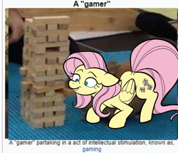 Size: 618x532 | Tagged: safe, artist:this_sl0th, fluttershy, pegasus, pony, g4, female, floppy ears, folded wings, full body, gamer, jenga, mare, meme, mouth hold, ponified animal photo, solo, wings