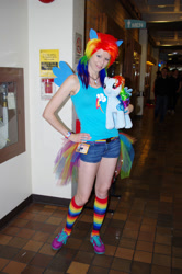 Size: 3264x4928 | Tagged: safe, rainbow dash, human, g4, anime evolution, clothes, cosplay, costume, hand on hip, irl, irl human, multicolored hair, photo, plushie, rainbow hair, rainbow socks, socks, solo, striped socks