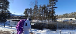 Size: 3264x1464 | Tagged: safe, artist:kuba18i, rarity, pony, unicorn, g4, female, horn, irl, mall, outdoors, photo, plushie, poland, pond, ponies around the world, ponies in real life, pony plushie, snow, solo, sosnowiec, tree, water