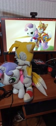 Size: 1830x4080 | Tagged: safe, artist:kuba18i, sweetie belle, fox, pony, unicorn, derpibooru, g4, computer, desk, duo, duo male and female, female, horn, indoors, irl, male, meta, miles "tails" prower, misleading thumbnail, monitor, photo, plushie, poland, ponies around the world, ponies in real life, pony plushie, riding, riding a pony, sonic the hedgehog (series), sosnowiec, webcam