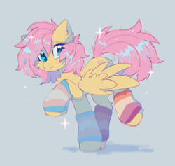 Size: 1800x1704 | Tagged: safe, artist:mirtash, fluttershy, pegasus, pony, g4, alternate hairstyle, blue background, clothes, colored eyebrows, cute, dots, ear tufts, eye clipping through hair, eyebrows, eyelashes, female, fluffy, leg warmers, lesbian pride flag, looking back, mare, partially open wings, pride, pride flag, raised hoof, raised leg, shadow, short hair fluttershy, short mane, shyabetes, simple background, smiling, solo, sparkles, sparkly hair, stray strand, trans female, trans fluttershy, transgender, transgender pride flag, trotting, wings
