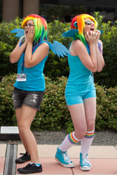 Size: 1675x2512 | Tagged: safe, rainbow dash, human, bronycon, bronycon 2014, g4, clothes, cosplay, costume, duo, fangirling, glasses, irl, irl human, multicolored hair, outdoors, photo, rainbow hair, sunglasses, unitard