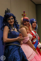 Size: 1500x2250 | Tagged: safe, artist:maddymoiselle, artist:sarahndipity cosplay, princess cadance, princess luna, shining armor, human, bronycon, bronycon 2018, g4, bare shoulders, clothes, cosplay, costume, irl, irl human, photo, trio