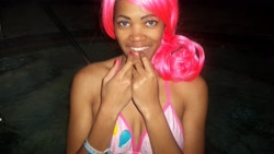 Size: 4288x2420 | Tagged: safe, artist:xaleux, pinkie pie, human, g4, african american, bikini, bikini top, blue eyes, breasts, clothes, cosplay, costume, dark skin, female, hot tub, irl, irl human, looking at you, photo, pink hair, pink mane, pinkie pie's cutie mark, smiling, smiling at you, solo, swimming pool, swimsuit, wig, woman