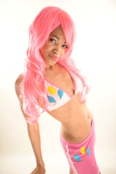 Size: 982x1472 | Tagged: safe, artist:xaleux, pinkie pie, human, g4, african american, belly, belly button, belly piercing, bikini, bikini top, blue eyes, clothes, collarbone, cosplay, costume, dark skin, female, irl, irl human, looking at you, midriff, photo, piercing, pink hair, pink mane, pinkie pie's cutie mark, ribs, shorts, smiling, smiling at you, solo, swimsuit, thin, wig, woman