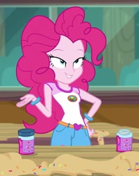 Size: 855x1080 | Tagged: safe, screencap, pinkie pie, human, equestria girls, g4, my little pony equestria girls: legend of everfree, belt, bracelet, clothes, cropped, female, food, grin, hand on hip, jewelry, lidded eyes, mid-blink screencap, shirt, shorts, smiling, solo, sprinkles, t-shirt