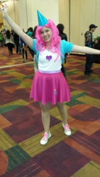 Size: 576x1024 | Tagged: safe, pinkie pie, human, g4, 2014, clothes, converse, cosplay, costume, female, hat, irl, irl human, jacket, party hat, photo, shirt, shoes, skirt, sneakers, solo focus, spread arms, t-shirt, wig