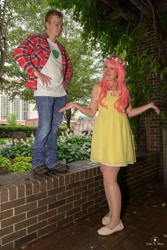 Size: 684x1024 | Tagged: safe, big macintosh, fluttershy, human, g4, 2015, brick wall, clothes, cosplay, costume, cutie mark on clothes, denim, dress, duo, duo male and female, female, floral head wreath, flower, hand on hip, holding hands, irl, irl human, jeans, looking at you, male, outdoors, pants, photo, plaid shirt, ship:fluttermac, shipping, shirt, shoes, shrug, straight, t-shirt, tree, wig, wings