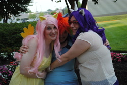 Size: 2896x1944 | Tagged: safe, fluttershy, rainbow dash, rarity, human, g4, ama-con, clothes, cosplay, costume, group hug, high res, hug, irl, irl human, multicolored hair, photo, rainbow hair