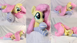 Size: 1920x1080 | Tagged: safe, artist:nakedskull, fluttershy, pegasus, pony, g4, clothes, folded wings, irl, lying down, multiple views, photo, plushie, prone, socks, solo, striped socks, wings