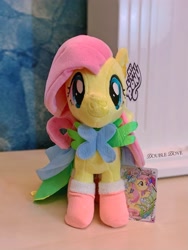 Size: 2389x3185 | Tagged: safe, fluttershy, pegasus, pony, g4, card, clothes, dress, front view, grand galloping gala, irl, kayou, looking at you, merchandise, outfit, photo, plushie, pony plushie, smiling, smiling at you, socks, solo