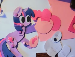 Size: 2048x1570 | Tagged: safe, artist:koidial, part of a set, pinkie pie, twilight sparkle, earth pony, pony, unicorn, g4, 3d cutie mark, bangs, big eyes, colored ear fluff, colored paper, craft, duo, duo female, ear fluff, ear tufts, eye clipping through hair, female, hoof hold, horn, lesbian, looking at someone, mad science, mare, no catchlights, no pupils, paper doll, papercraft, photo, pink mane, pink tail, purple coat, ship:twinkie, shipping, straight mane, straight tail, tail, three toned mane, three toned tail, traditional art, unicorn twilight