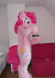 Size: 1138x1608 | Tagged: safe, artist:spainfischer, pinkie pie, g4, fursuit, hoof hold, indoors, irl, photo, ponysuit, remote control, solo