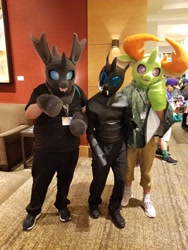 Size: 1536x2048 | Tagged: safe, artist:limeythecheetah, photographer:chainchomp2, thorax, changedling, changeling, human, g4, clothes, convention, cosplay, costume, everfree northwest, everfree northwest 2023, fursuit, irl, irl human, king thorax, photo, trio