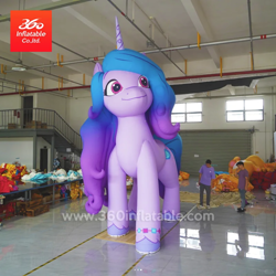 Size: 1080x1080 | Tagged: safe, izzy moonbow, human, inflatable pony, pony, unicorn, g5, 360 inflatable, female, horn, indoors, inflatable, inflatable toy, inflatable unicorn, irl, irl human, izzy is tol, mare, photo, solo