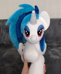 Size: 1695x2048 | Tagged: safe, artist:mdcraft10, dj pon-3, vinyl scratch, pony, unicorn, g4, female, hand, horn, indoors, irl, looking at you, lying down, photo, plushie, solo