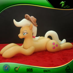 Size: 600x600 | Tagged: safe, applejack, earth pony, inflatable pony, pony, g4, bootleg, carpet, female, frame, freckles, hair tie, hat, hongyi, indoors, inflatable, inflatable earth pony, inflation valve, irl, lidded eyes, lying down, mare, matte, opaque inflatable, photo, ponytail, prone, red carpet, solo, sploot