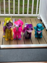 Size: 3024x4032 | Tagged: safe, twilight sparkle, alicorn, pony, unicorn, g4, blossom (furreal), cinnamon (furreal), female, furreal, furreal friends, horn, irl, mare, outdoors, photo, rain, raincoat, rainhat, robotwi, starlily, toy