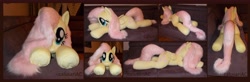 Size: 9048x2984 | Tagged: safe, artist:calusariac, fluttershy, pegasus, pony, absurd resolution, irl, lying down, photo, plushie, prone, solo, sploot