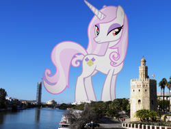 Size: 2048x1536 | Tagged: safe, artist:90sigma, edit, editor:jaredking779, fleur-de-lis, pony, unicorn, g4, alternate eye color, attack on pony, concave belly, evil, eyeshadow, female, giant pony, giantess, highrise ponies, horn, irl, lidded eyes, looking at you, macro, makeup, mare, photo, ponies in real life, seville, smiling, solo, spain, standing, story included, wrong eye color