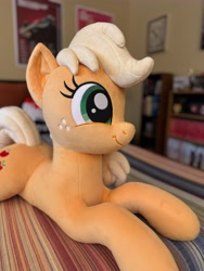 Size: 3072x4096 | Tagged: safe, artist:littlefairyswonders, photographer:formulapony, applejack, earth pony, pony, g4, cute, female, indoors, irl, jackabetes, lying down, missing accessory, photo, plushie, solo