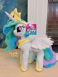 Size: 3178x4238 | Tagged: safe, princess celestia, alicorn, pony, g4, official, double dove, horn, irl, jewelry, merchandise, photo, plushie, pony plushie, side view, smiling, solo, standing, text, tiara, wings