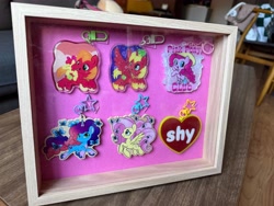 Size: 5712x4284 | Tagged: safe, artist:amynewblue, apple bloom, big macintosh, fluttershy, misty brightdawn, pinkie pie, alicorn, butterfly, earth pony, pegasus, unicorn, g4, g5, alicornified, charm, display case, horn, merchandise, photo, photography, princess big mac, race swap, shy