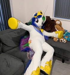 Size: 1876x2000 | Tagged: safe, artist:atalonthedeer, princess celestia, g4, couch, fursuit, indoors, irl, jewelry, photo, ponysuit, regalia, sitting, solo