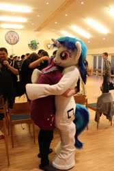 Size: 1382x2074 | Tagged: safe, artist:atalonthedeer, dj pon-3, vinyl scratch, human, g4, 2013, duo focus, fursuit, indoors, irl, irl human, photo, ponysuit, red eyes, wwu