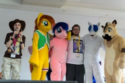 Size: 1024x681 | Tagged: safe, artist:atalonthedeer, firefly, shining armor, oc, oc:canni soda, human, galacon, g1, g4, 2012, furry, furry oc, fursuit, group, indoors, irl, irl human, photo, ponysuit, stage