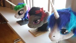 Size: 4128x2322 | Tagged: safe, artist:atalonthedeer, octavia melody, princess celestia, shining armor, galacon, g4, 2013, disembodied head, fursuit head, irl, photo, ponysuit, table, trio