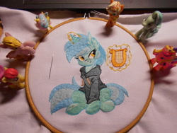 Size: 5152x3864 | Tagged: safe, artist:ambris, artist:lightdragon1988, lyra heartstrings, pony, unicorn, g4, clothes, dig the swell hoodie, ear fluff, embroidery, hoodie, horn, irl, lyre, magic, magic aura, musical instrument, photo, sitting, smiling, telekinesis, toy