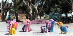 Size: 4000x1985 | Tagged: safe, artist:dingopatagonico, princess cadance, starlight glimmer, sunburst, sunset shimmer, trixie, twilight sparkle, alicorn, pony, unicorn, g4, cape, cloak, clothes, forced perspective, hat, horn, outdoors, photo, sunburst's cloak, trixie's cape, trixie's hat, twilight sparkle (alicorn)