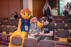 Size: 1920x1281 | Tagged: safe, oc, oc only, oc:tracy swift, human, 2016, brony fair, fursuit, hug, indoors, irl, irl human, photo, ponysuit, sitting